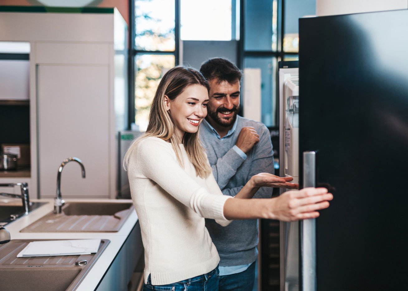 couple opening refrigerator 