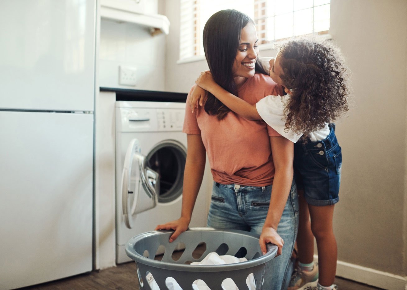 mom and daughter doing laundry